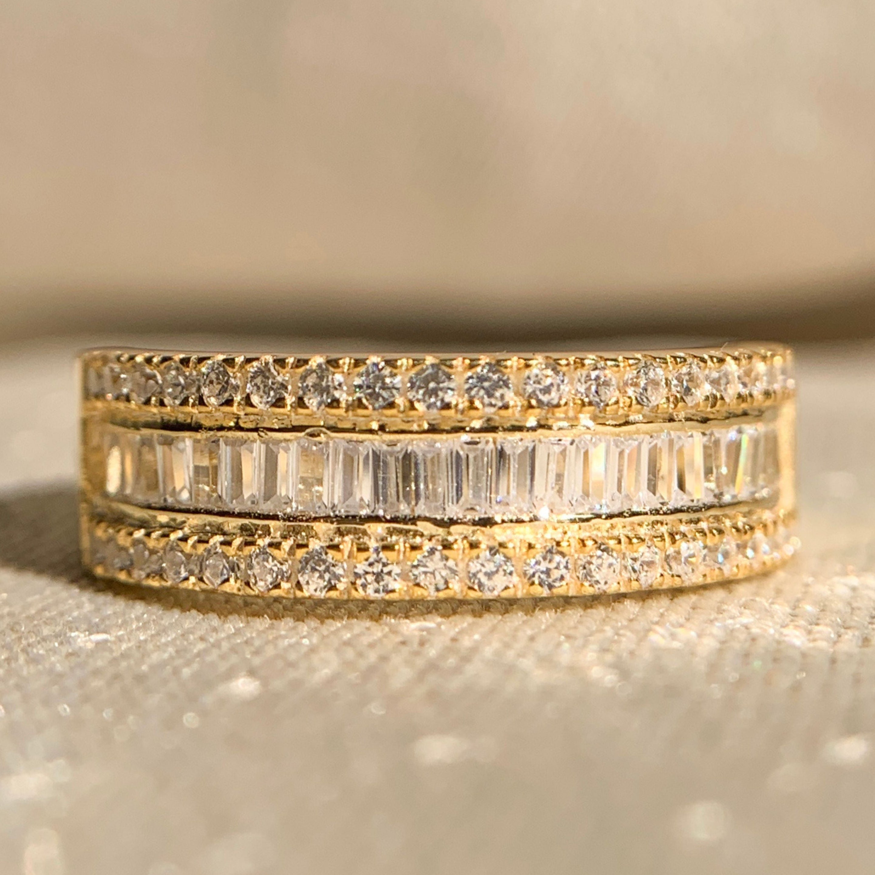 Round and baguette diamond half eternity band in white gold